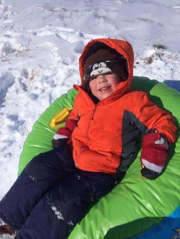 Nick snow tubing at Grammy's